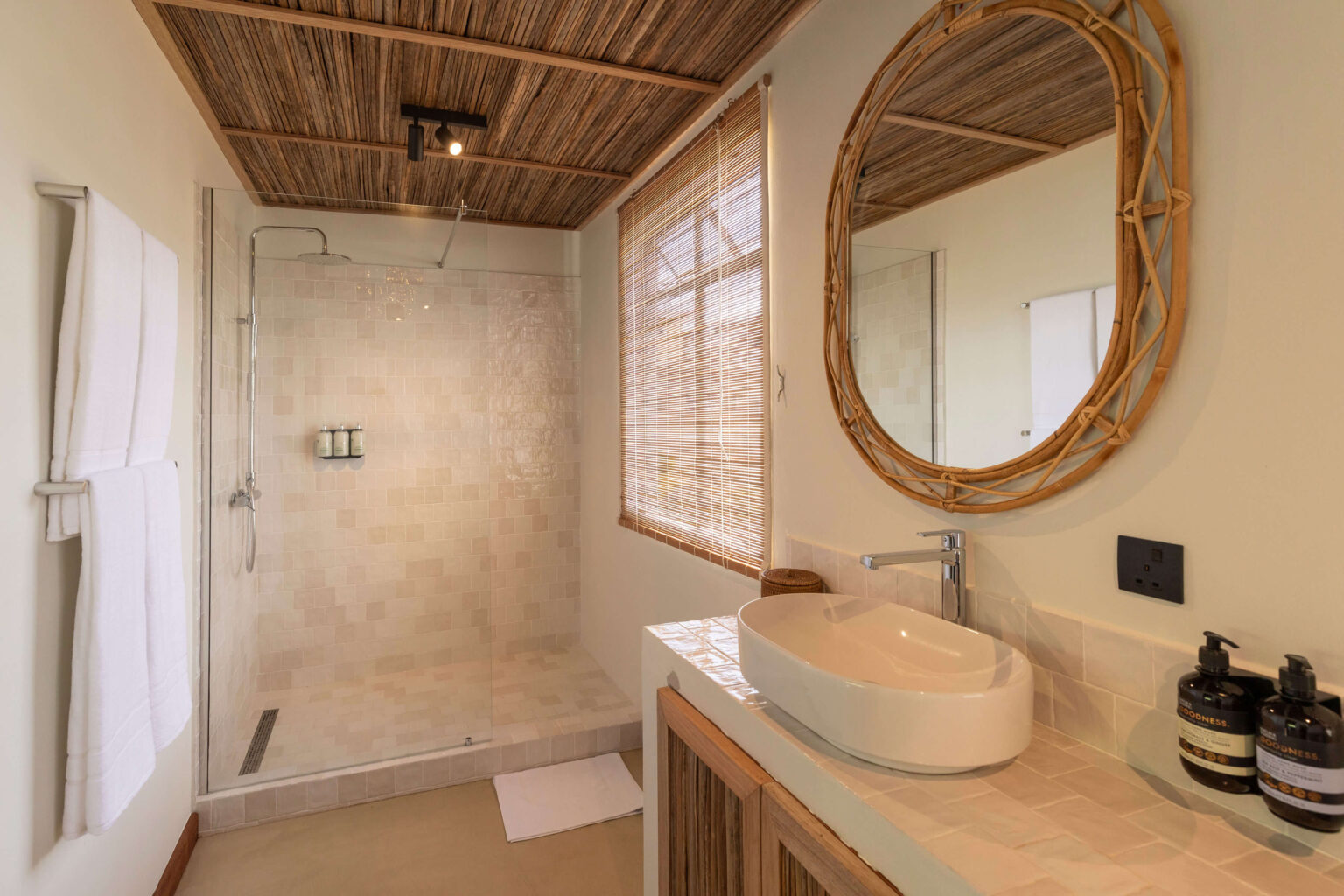 Bathrooms finished with handmade Portuguese tiles and Mauritian rattan.