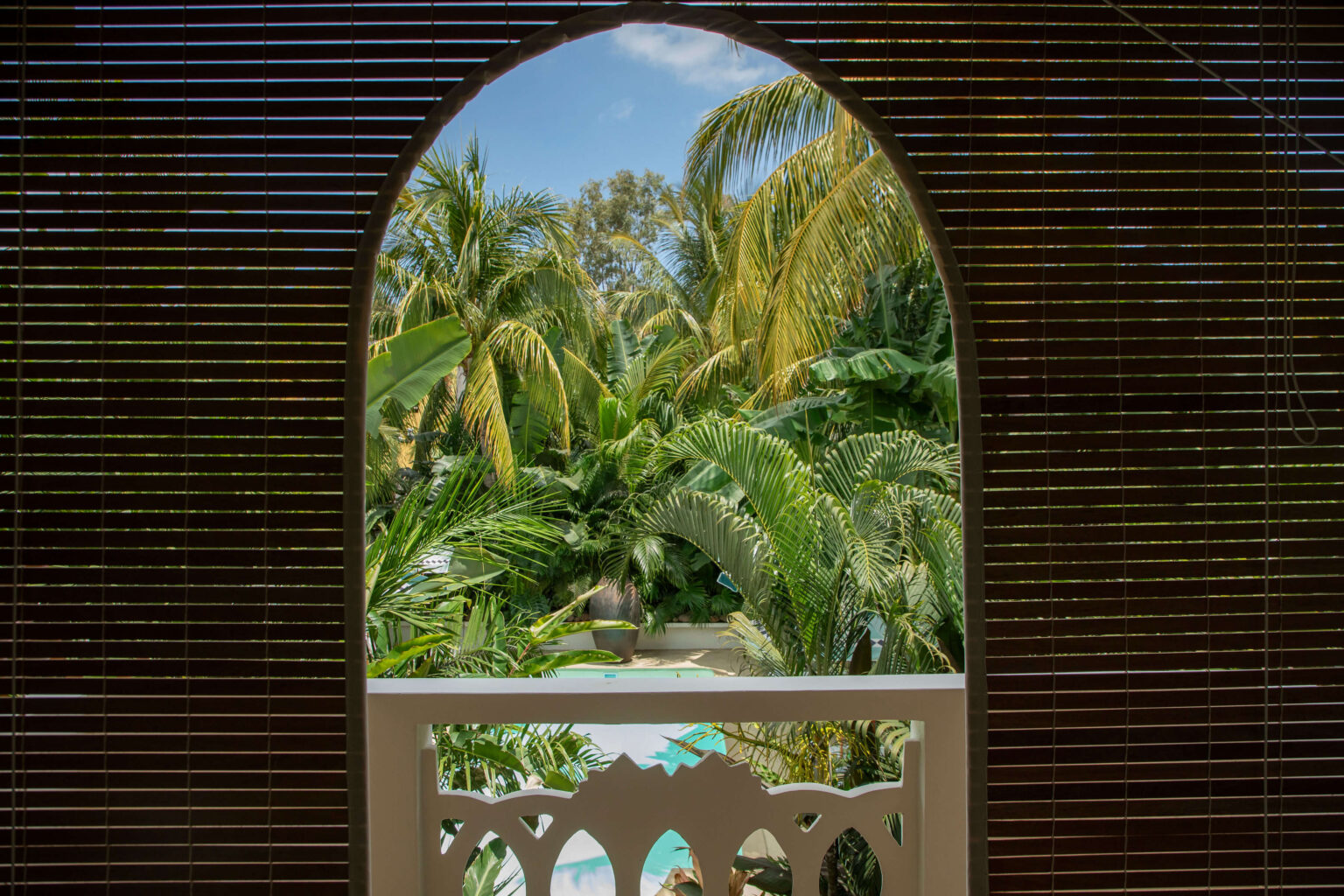 All balconies face the tropical garden, immersed in lush greenery.
