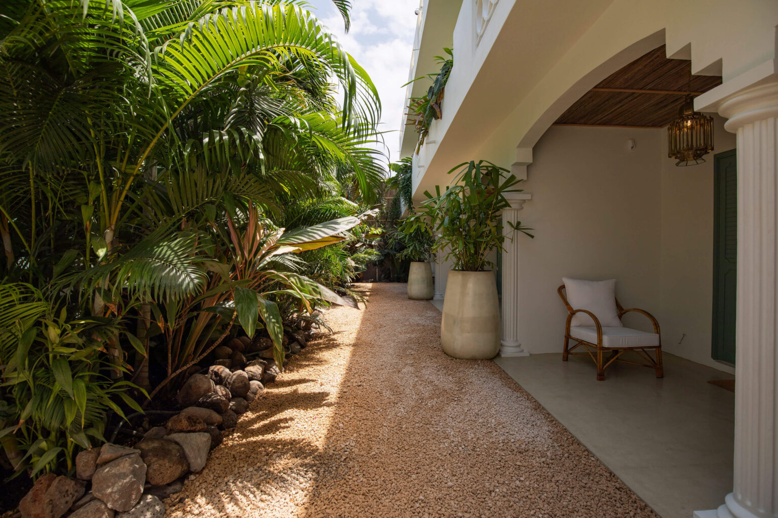 Each suite faces the garden, with a terrace set within lush greenery.