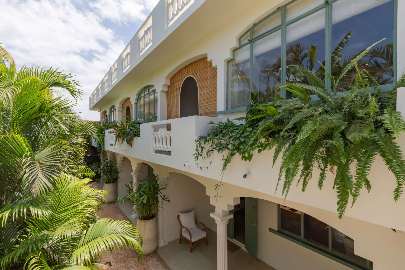 Traditional Mauritian handmade blinds shade the private balconies