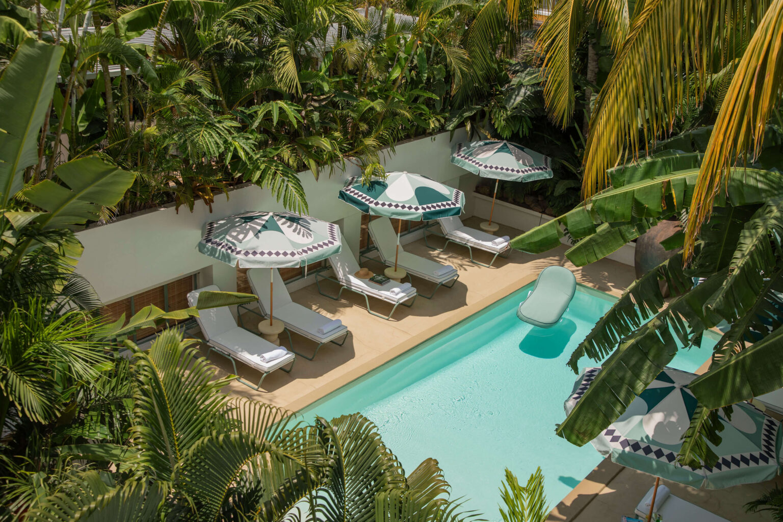 A dreamy pool setting, serene beneath tropical light.